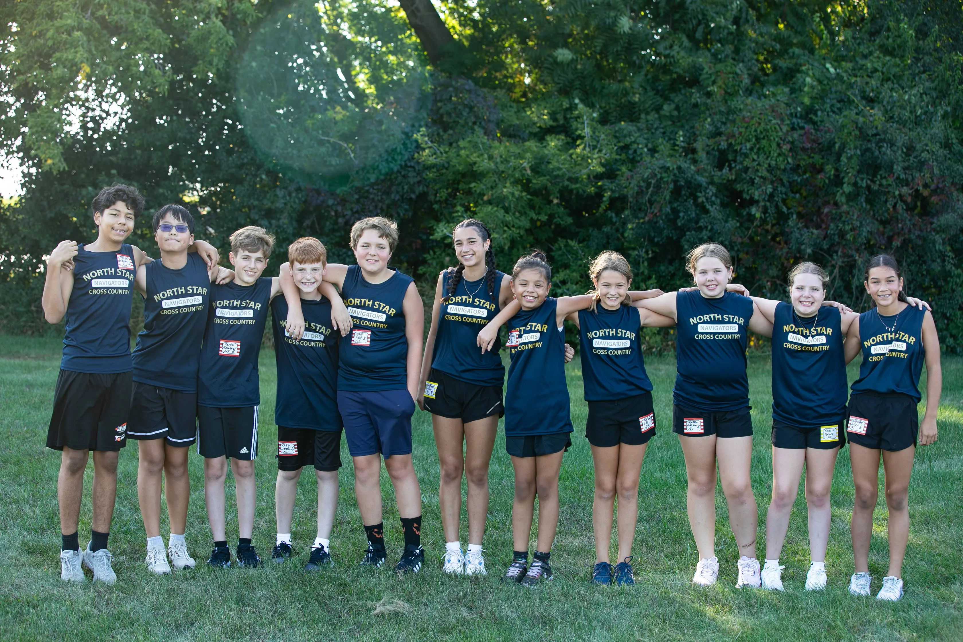 North Star student crossing finish line at cross country meet